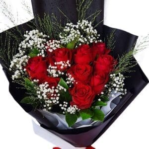 Red Roses in a Black Wrap Bouquet close up