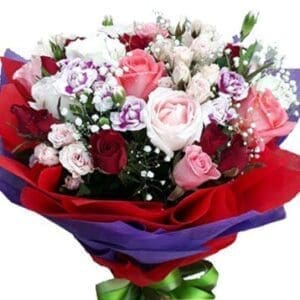 A mix of Roses & Carnations in a bouquet - close up